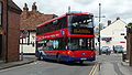 English: Wilts & Dorset 1122 (HF58 GZB), a Scania OmniCity, turning from Salt Lane into Rollestone Street, Salisbury, Wiltshire, on route X3.