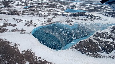 Frozen melt pond, Greenland