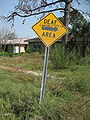 Modified street sign a year after the disaster