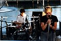 Linda Hopper (singer) and Mark Posgay (drummer) performing with Magnapop at an outdoor gig in Providence, Rhode Island, United States on 1996-08-08