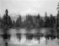 "View_of_Mount_Shasta_overlooking_a_lake,_Siskiyou_County,_ca.1900-1940_(CHS-5074).jpg" by User:Fæ