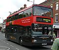 English: Wilts & Dorset 3156 (R156 NPR), a DAF DB250/Optare Spectra, in Blue Boar Row, Salisbury, Wiltshire, on the Stonehenge Tour. It is wearing the new livery for the service.