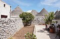 * Nomination Courtyard of a trullo in Alberobello, Italy --Bgag 02:22, 19 August 2024 (UTC) * Promotion  Support Good quality. --Johann Jaritz 03:12, 19 August 2024 (UTC)