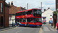 English: Wilts & Dorset 1118 (HF58 GYW), a Scania OmniCity, turning from Salt Lane into Rollestone Street, Salisbury, Wiltshire, on route X3.