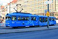 English: An old tram with a low-floor extension part in middle of it Suomi: Vanha ratikka, laajennusosa keskellä
