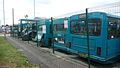 English: The Arriva The Shires High Wycombe depot. It was opened in 2005, and is situated in Lincoln Road, Cressex Industrial Estate, High Wycombe, Buckinghamshire. This photograph shows "death row", a line of withdrawn, accident damaged, sold or otherwise dead buses. Note the fire victim.