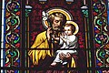 Saint Joseph and Jesus Christ as a baby on stained glass windows