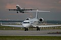 taxiing, nearly front view, A340 taking off in background