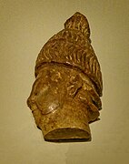 Head of a warrior wearing boar tusk helmet carved of hippopotamus ivory from Phylaki, 1375-1300 BCE, Archaeological Museum of Chania (Crete).jpg