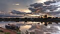 31 Water reflection of sunset with gray and orange clouds and boats moored to the bank in Pakse Laos uploaded by Basile Morin, nominated by Basile Morin,  17,  0,  0