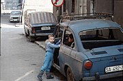 Children play with a wrecked car in the Baščaršija (old town) district.