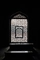 The symbolically cut out, mihrab facing West or Mecca, over the marble lattice screen.