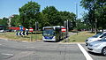 English: Metrobus 578 (YT09 BKV), a Scania OmniCity, in Crawley, West Sussex, on route 10, driving out of the bus lane over the middle of Tushmore Roundabout.