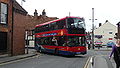 English: Wilts & Dorset 1133 (HF09 BJJ), a Scania OmniCity, turning from Salt Lane into Rollestone Street, Salisbury, Wiltshire, on the Activ8 service.