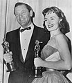 William Holden and Donna Reed hold their Oscars, 1954