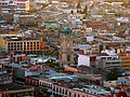 Reloj de Pachuca iluminado por la puesta del Sol.