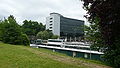 English: Bracknell bus station, Bracknell, Berkshire, England. In the background (the building with the office block on top), Bracknell railway station can be seen.