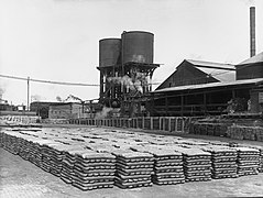 Lead ingots stacked at smelter, Port Pirie (HTSA GN07923 - repaired).jpg