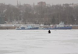 Snowing, Lonely fisherman, Ice fishing, Don River in ice, Rostov-on-Don, Russia.jpg