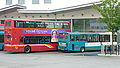 English: Two buses in High Wycombe bus station, High Wycombe, Buckinghamshire. One the left is First Berkshire & The Thames Valley TN32963 (X963 HLT), a Dennis Trident/Plaxton President. On the right is Arriva The Shires 3833 (M503 VJO), a Dennis Dart SLF/Marshall. Both buses are on route 74, which Arriva and First run in competiton on. The First journeys run a few mintues ahead of Arriva. However, First only run one bus an hour, whereas Arriva run two.