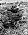 Tanks and ACAVs form defense perimeter at bridge site.