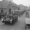 A Bren Gun Carrier brings in a batch of German prisoners, 1944.