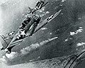 SBDs over the burning Japonese cruiser Mikuma, 6 June, 1942