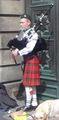 a piper busking in Edinburgh