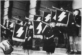 Weihestunde der HJ vor dem Rathaus in Tomaschow am 11.5.1941. Hitler Youth Hour of Commemoration in front of the Town... - NARA - 540131.tif