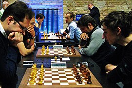 Péter Lékó (li.) und Daniil Dubov (re.) bei der Blitzschach-WM 2015 in Berlin.jpg