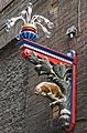 Street Lamp bearing the colors and symbol of the contrada