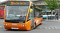 English: Arriva The Shires 2401 (YJ57 EKF), an Optare Versa, leaving High Wycombe bus station into Bridge Street, High Wycombe, Buckinghamshire, on Orange Route service 39, part of the High Wycombe Rainbow Routes network, supported by Buckinghamshire County Council. Optare Versas have an epecially long front overhang, and this image shows the bus swinging out of the bus station and grounding the front out on the ramp. You can see the gouge in the road left from other times this happens. When it happened, there was a very loud scrape.