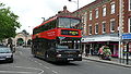 English: Wilts & Dorset 3156 (R156 NPR), a DAF DB250/Optare Spectra, in Blue Boar Row, Salisbury, Wiltshire, on the Stonehenge Tour. It is wearing the new livery for the service.