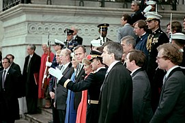 GEN Edward C. Meyer, U.S. Army chief of staff, describes one of the Army marching units in the Inaugural parade to president Ronald W. Reagan and Vice President George Bush. Standin - DPLA - e61bb99cc407a3d0402a88fb94923934.jpeg