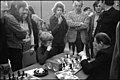 Brother at chess bord (left) and father (in the back, arms crossed) at Hoogovens Chess Tournament in Jan. 1974