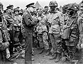 Gen. Dwight D. Eisenhower gives the order of the D-Day. `Full victory-nothing else' to paratroopers in England, just before they board their airplanes to participate in the first assault in the invasion of the continent of Europe.