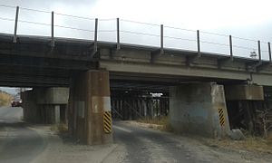 Heading east; 2nd RR bridge over E 60th Ave, Commerce City, CO.jpg