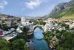 第二名： Stari Most, the "Old Bridge", which connects the two banks of river Neretva, has been a symbol of Mostar for centuries. This view from north shows Helebija tower to the left and Tara tower to the right. It was made from the minaret of Koski Mehmed Pasha Mosque. (POTD) – Credit: Own work by Ramirez. (GFDL, CC-BY-SA-3.0,2.5,2.0,1.0)