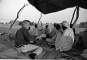 Scott Pelley (left) with Darfur refugees in the Sudan