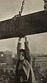 Hanging onto a girder in Never Weaken, 1921