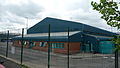 English: The Arriva The Shires High Wycombe depot. It was opened in 2005, and is situated in Lincoln Road, Cressex Industrial Estate, High Wycombe, Buckinghamshire. This photograph shows the depot building.