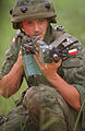 An AKMS in the hands of a Polish soldier. Seen here fitted with a training device.