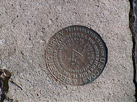 The highpoint marker near the tower.