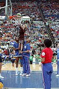 Nancy Reagan being lifted to the basket by Charles Barkley and Wayman Tisdale at a "Just Say No" Basketball game in Indianapolis.jpg