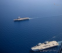 U.S. Navy and Marine Corps aircraft fly over HMS Queen Elizabeth (R09), bottom, and FS Charles de Gaulle (R91) in the Mediterranean Sea.jpg