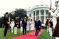 The Fords escort the Nixons to a waiting Presidential Helicopter.