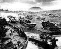 Amtracs and other vehicles of war lay knocked out on the black sands of Iwo Jima, ca. February/March 1945.