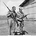 Thumbnail for File:Australian and U.S. soldiers examine captured Vietcong weapons.jpg