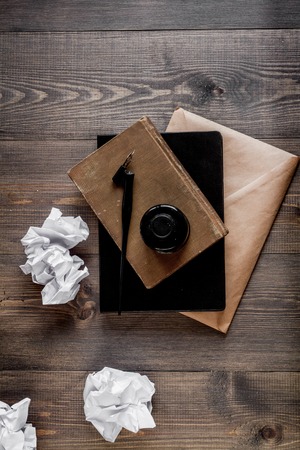 Writer workplace with tools on wooden background top view Фото со стока