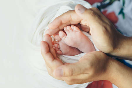 Baby s feet fingers close up newborn baby legs massage concept of childhood health care ivf hygiene